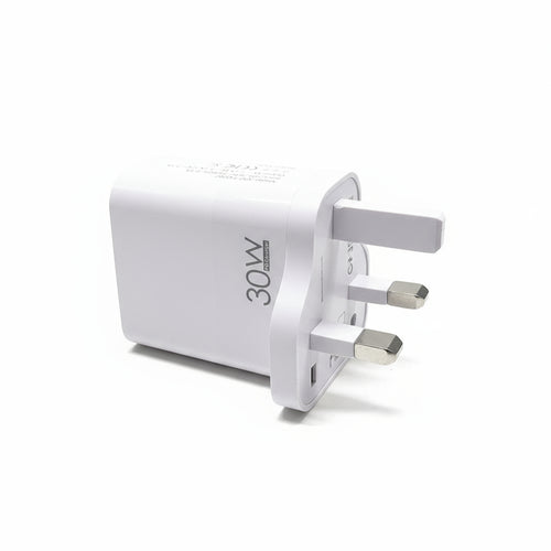 30W power adapter with multiple ports on a white wall