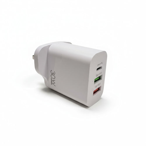White power adapter for iphone and for samsung with multiple ports on a white wall