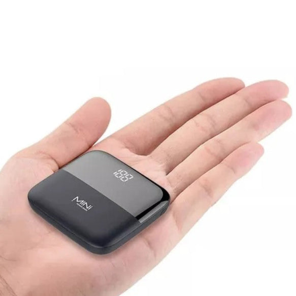 Mini powerbank in the palm of a hand for size comparison 