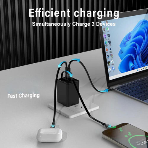 A portable multi-device charger shown on a desk, plugging into a wall outlet while charging a white earbud case, a black laptop, and a smartphone. Text on the image reads 'Efficient charging' and 'Simultaneously Charge 3 Devices', with additional text 'Fast Charging'.